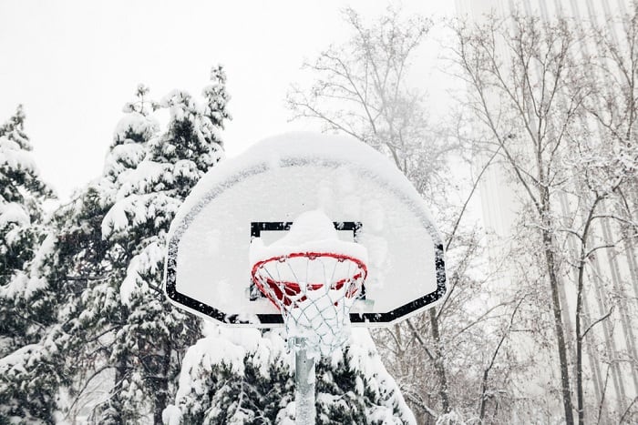Front view of basketball hoop under the snow