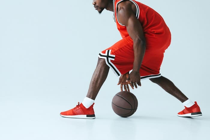 Basketball player with basketball in hands