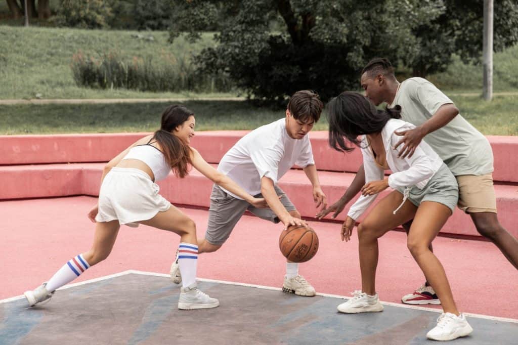 friends playing basketball game