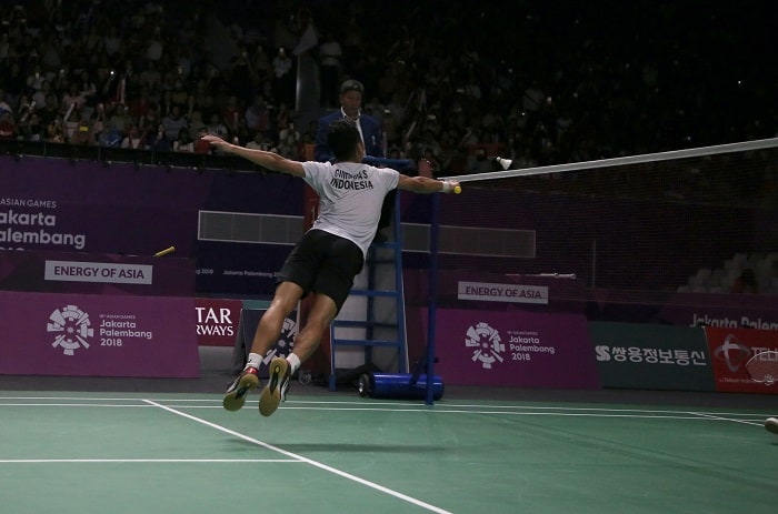 Badminton player jumping during the game