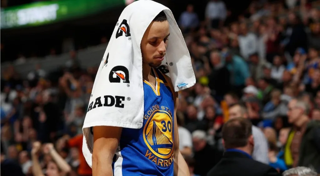 Basketball player with a towel on his head.