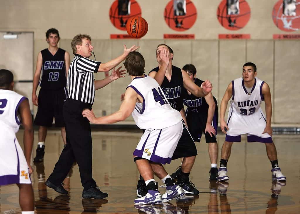 basketball referee officiating a game