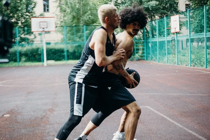 two basketball players playing basketball