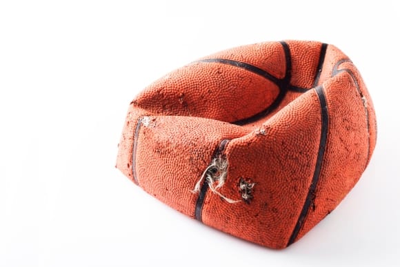 deflated basketball in a need of patching