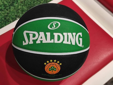  a black and green spalding basketball
